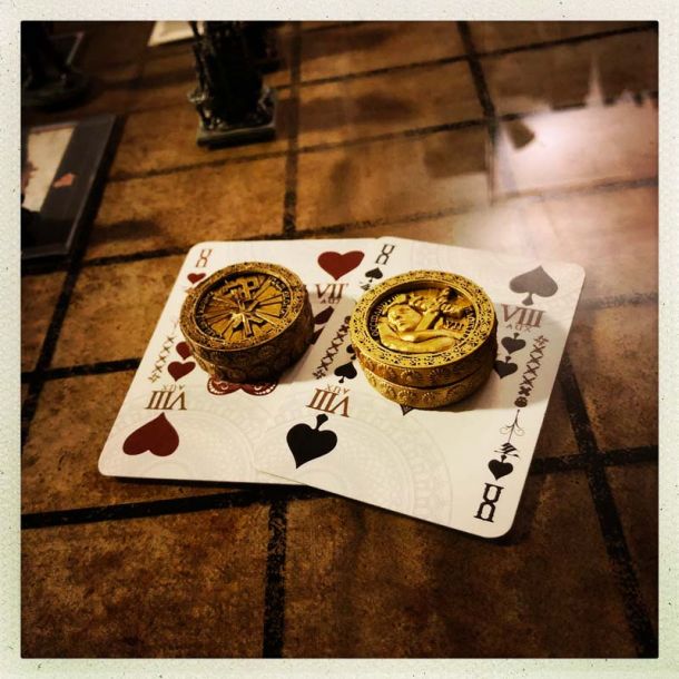 playing cards with golden coins on them